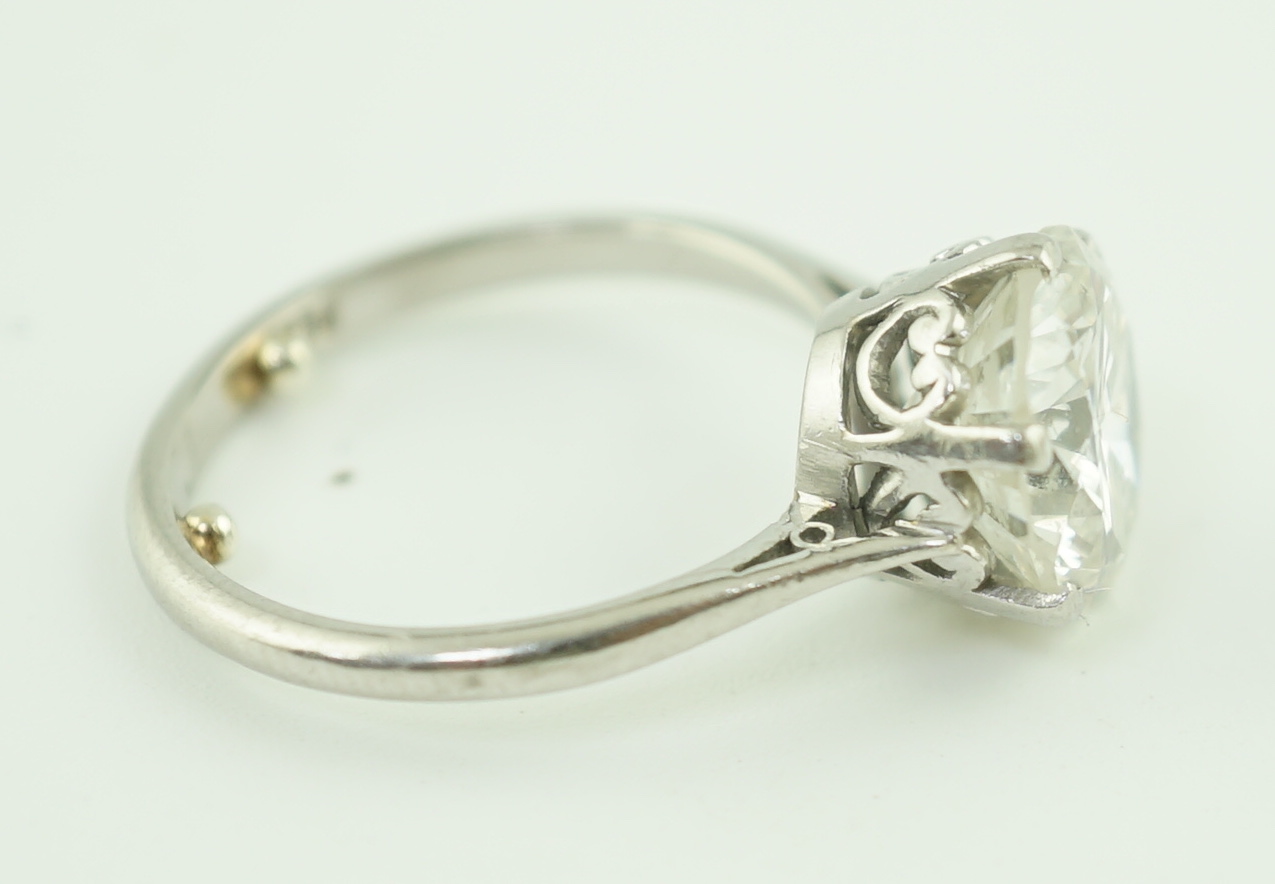 A mid 20th century platinum and solitaire diamond set ring